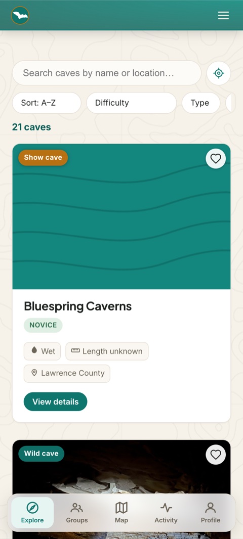 The Explore screen — searchable, filterable cave cards